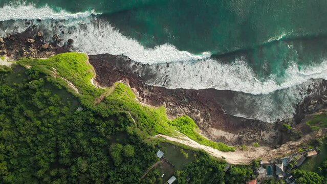 Huge oceanic waves crashing steep cliffs at Uluwatu, Bali, Indonesia.
DJI Mavic drone beautiful relaxing aerial footage 