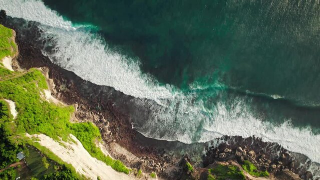 Huge oceanic waves going backwards crashing steep cliffs at Uluwatu, Bali, Indonesia.
DJI Mavic drone beautiful relaxing aerial footage 