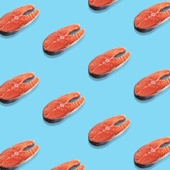Piece of a salmon on blue background. Top view. Pop art design.