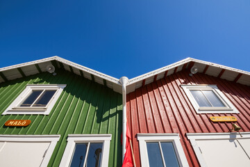 Wooden red and green boat / fisherman huts in Sweden