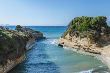 Afionas, Greece - June 19, 2021: Beach over Channel of Love in Sidari village