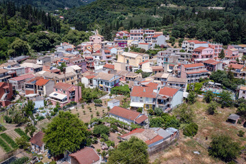 Fototapeta na wymiar Benitses, Greece - June 20, 2021: Drone photo of Benitses town
