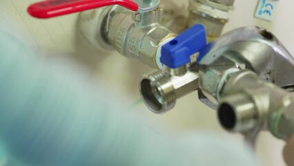 tightening the threaded connection of plumbing pipes with a wrench