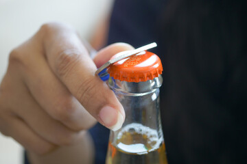 Metal cap and opener on the glass bottle