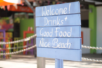 Welcome drinks, good food and nice beach sign