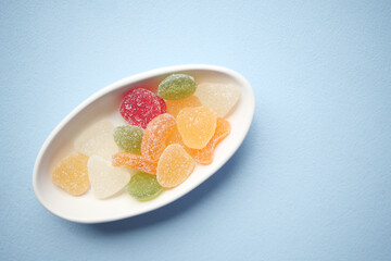 colorful candy sweet jelly in a bowl on table 