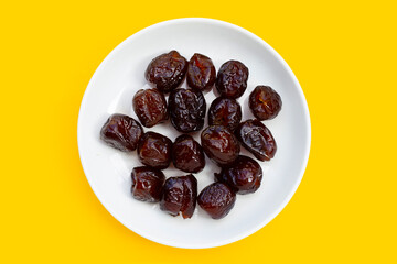 Sweet chinese jujube dessert on yellow background.