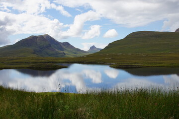 Lochan an Ais with Cul Beag (left) and Stac Pollaidh (centre), from Knockan Crag National Nature Reserve and Geopark, Assynt, near Ullapool, Sutherland, North West Scotland