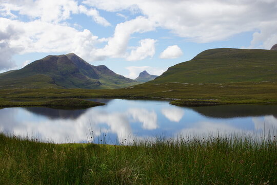 Lochan an Ais with Cul Beag (left) and Stac Pollaidh (centre), from Knockan Crag National Nature Reserve and Geopark, Assynt, near Ullapool, Sutherland, North West Scotland