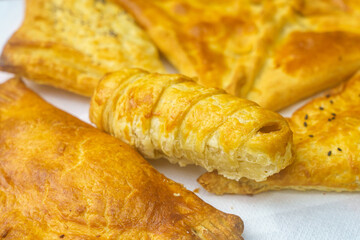 Appetizing pastries. Fast food. Snack from the bakery for a break. Background with selective focus