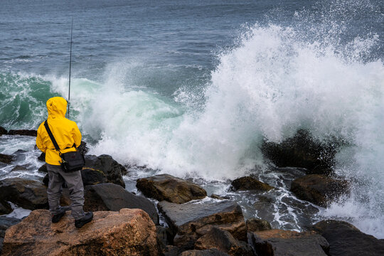 man striper fishings surf casting 
