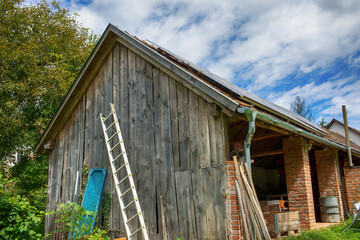 Fototapeta na wymiar View of an old wooden barn.Summer season.