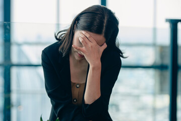 Fototapeta premium Businesswoman, woman, showing signs of stress, worry, anxiety, panic, in various problems.