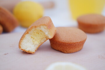 Lemon cake with lemon on wood background. Selective focus.