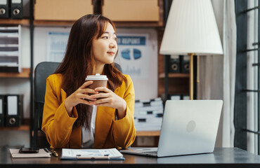 Holding coffee, Cute Asian korean business woman as MBA Fresh Graduate No Experience jobs and career opportunities, remote online job to see detailed job requirements, compensation, employer history