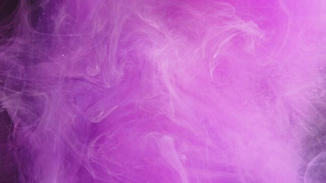 Color vapor. Ink water drop. Reveal effect. Magic spell. Neon pink purple pigment haze cloud explosion wave abstract art background.