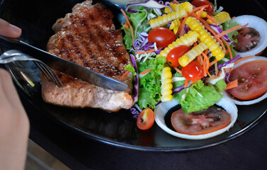 Steak and salad on plate popular food