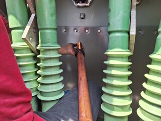 Jakarta, Indonesia, 14 July 2023; Removal of the 20kv secondary bushing conductor inner side of the transformer