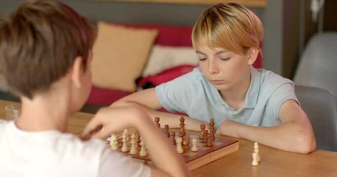 Children Engaging in Chess at School Competitions. Boy navigates intricacies of game. Move is decision fraught with consequences, requiring to foresee consequences choices, consider tactics opponents.