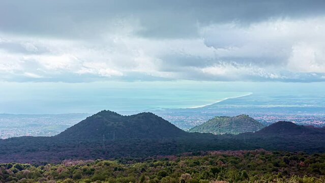 A Time Lapse Shot Of A Wind Shear Above the Mountains And A Forest Landscape