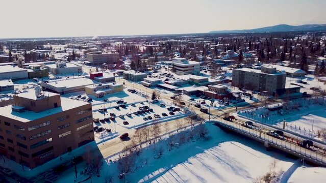 4K Drone Video of Frozen Chena River in Downtown Fairbanks Alaska on Snowy Winter Day