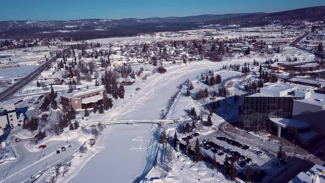 4K Drone Video of The William Ransom Wood Centennial Bridge over Frozen Chena River in Downtown Fairbanks Alaska on Snowy Winter Day