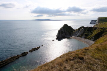 Beautiful wild and rugged cliffs, beach and ocean scenic views of Jurassic Coast in Southern England 