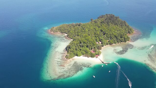 Aerial Overhead View Of Sapi Island On Clear Sunny Day. Descending Shot