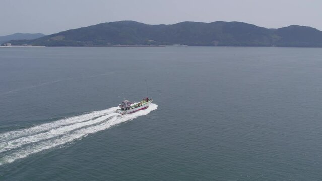 Drone Shot of a Fishing Boat Departing from Ishinomaki Fishing Market