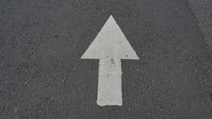 road and arrow. asphalt texture.