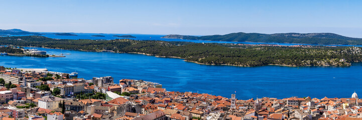Naklejka na ściany i meble Panorama, wide shot of the Sibenik, Croatia. Aerial view of the Sibenik old city and adriatic sea. Dalmatia. Panorama of the mediterranean city of Sibenik