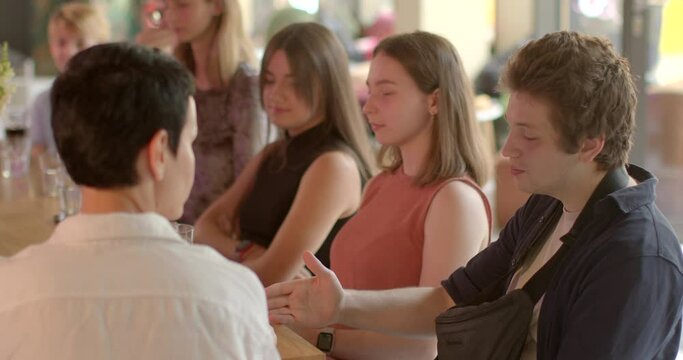 Young man portrait guy talking during group psychotherapy session. Talk Therapy helping students cope with challenges, maintain emotional, psychological well-being. Mental health support for students.