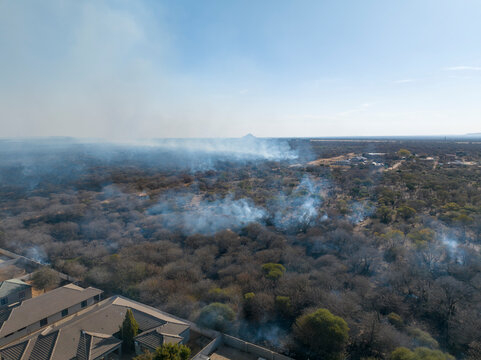 aerial view, wild bushfire was announced is out of control and approaching residential neighborhood