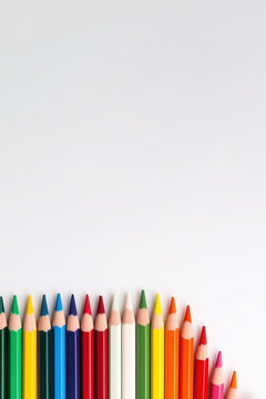 A group Colored pencils row on white background