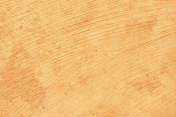 Gold stucco with shadow on concrete wall background.