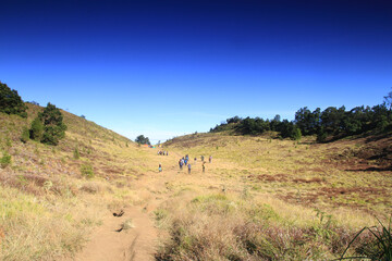 Naklejka premium Beautiful view of Mount prau, blue sky and sunrise in the Dieng, Wonosobo, Central Java, Indonesia, August 13, 2023