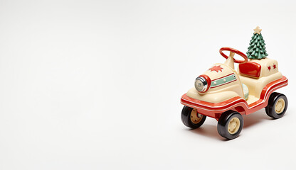 Classic holiday-themed toy car carrying a miniature pine tree, with vibrant colors, on a white setting.