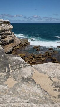4k Video-Vertical orientation-Panning views over coast, cliff and ocean on the scenic Cape Baily Track at Kurnell in Kamay National Park, South Sydney, Australia. 