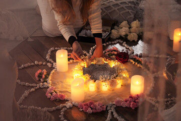 Close up of womens hands creating beautiful flower mandala at women's circle event