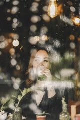 woman in rainy day in cafe