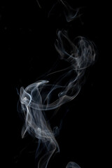 White clouds of smoke with copy space on black background