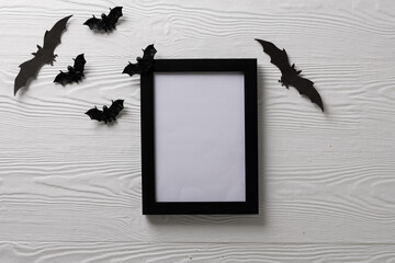 Black frame and bats with copy space on white background