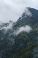 Mist covered alpine mountains 