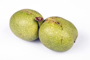 Fruits green walnuts on white background