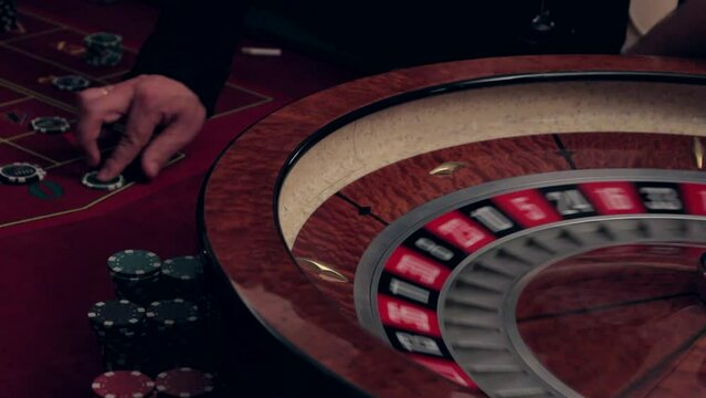 Roulette in the casino. The lucky number drops out. Casino spinning roulette and falling lucky number
