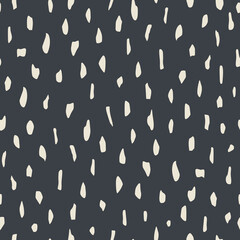 Abstract shapeless spots form a seamless pattern for contemporary textiles, decorative wrapping paper. White and black.