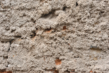Authentic old rough building wall facade texture. Antique architecture detail, vintage neutral beige house exterior