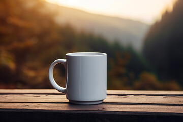 Ceramic white mug with place for branding standing on wooden table against backdrop of an autumn forest. Close-up cup mockup in nature