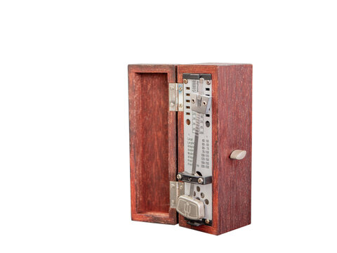 An old fashioned metronome ,made from wood box, white background
