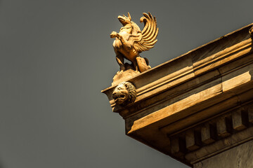 A Griffin statuette stands on the roof of Athens National University. Since antiquity, griffins...